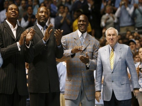 Former University of North Carolina players Sam Perkins, James Worthy and Michael Jordan, along with former North Carolina head basketball coach Dean Smith, watch a presentation honoring the 1957 and 1982 national championship teams on Feb. 10, 2007. (Ellen Ozier/Reuters) 